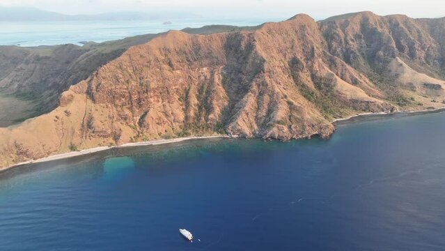 Beautiful evening light illuminates the volcanic island of Gili Banta, not far from Komodo National Park. This beautiful area of Indonesia is known for its astounding marine biodiversity.