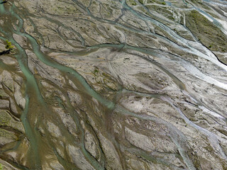 Close up aerial view of the Rio Sacambaya landscape with a huge riverbed and river channels branching in the Bolivian Andes in South America