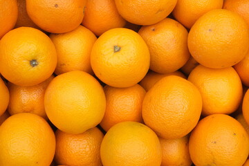 Closeup of fresh oranges on a market