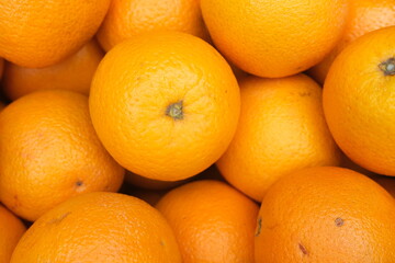 Pile of fresh ripe oranges as background, top view