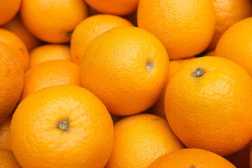 Fresh oranges texture , in bright light