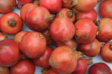 Fototapeta na wymiar Plie of Ripe red pomegranates.