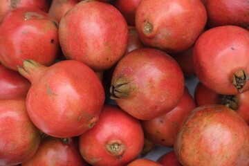 Fototapeta na wymiar Fresh Pomegranates at Farmers market ,red fruit