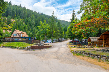 A rustic mountainside RV park and campground at Wolf Lodge Bay near the lake in Coeur d'Alene, Idaho, USA.