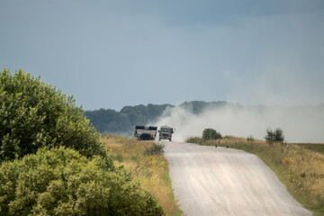 British army Challenger II 2 Titan Armoured Vehicle Launcher Bridge (AVLB) travelling along a dusty...