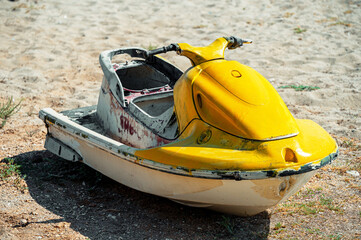 old jet ski on abandoned beach. old age water scooter