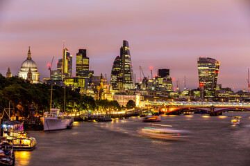 Fototapeta na wymiar Panorama of Skyscrapers over the River Thames in London at night