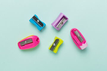Different sharpeners on color backgroung, top view