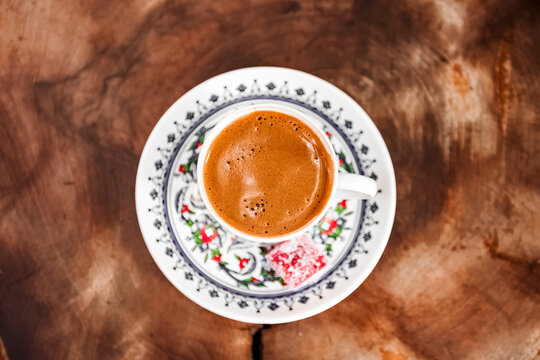 the typical Turkish coffee, served in a porcelain cup painted by Turkish master craftsmen, and accompanied by lokum, a gummy fruit candy