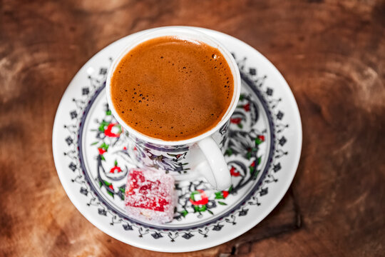 the typical Turkish coffee, served in a porcelain cup painted by Turkish master craftsmen, and accompanied by lokum, a gummy fruit candy