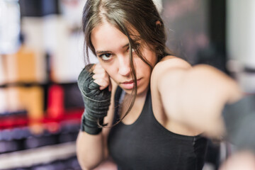 K1 mixed martial arts, Hispanic young woman fighter doing aerobox for cardio. Power strengh action