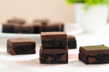 Homemade caramel chocolate brownies with dark chocolate ganache.