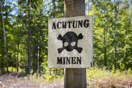 Warning of mines. Danger of explosion. Line of defense. Military base. German inscription: "Danger mines"