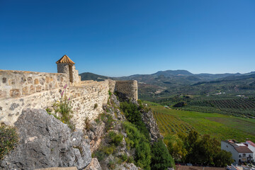Fototapeta na wymiar Walls of Olvera Castle and Sierra del Tablon Mountains View - Olvera, Andalusia, Spain