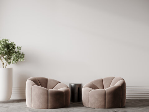 Room in tan and taupe colors. Small beige brown armchairs and metal table. Minimalistic living room space for art. Blank wall paint in pastel tone gray. Lounge or premium reseption, office. 3d render