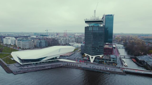 Amsterdam, Netherlands: view at the Eye Film Museum and the A'DAM tower by the river IJ . High quality 4k footage