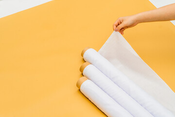 The minimalist design accentuates the beauty and versatility of a white fabric roll image in this...