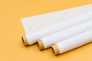 Envisioned in a minimalistic environment, the mockup of a white fabric roll image creates a visually striking presentation
