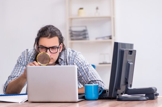 Young male it specialist working in the office