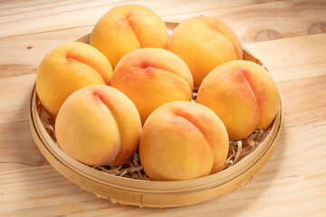 Golden Peach fruit on wooden background, Fresh Yellow Peach.