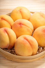 Golden Peach fruit on wooden background, Fresh Yellow Peach.