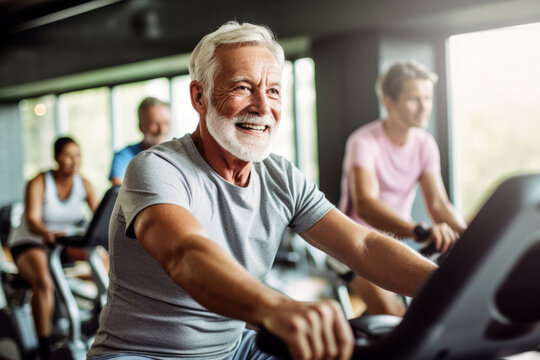 Portrait Of Senior Man Training On Stationary Bike Workout In Gym. Concept Senior Active Lifestyle. Generative Ai