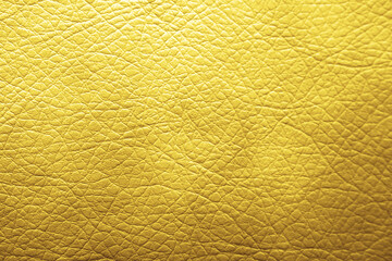 Golden textured surface as background, closeup view