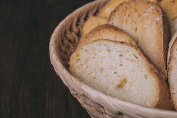Delicious croutons. Pieces of roasted white bread. Sliced bread closeup. Croutons in the wicker basket.