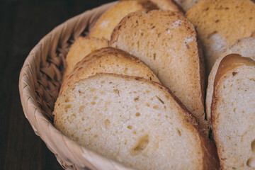 Delicious croutons. Pieces of roasted white bread. Sliced bread closeup. Croutons in the wicker basket.