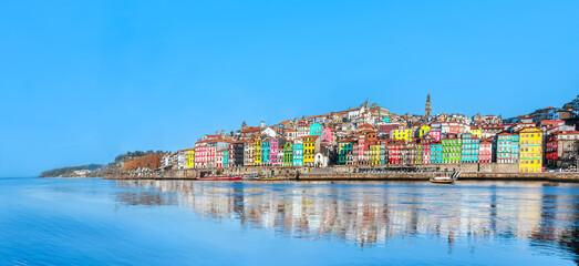 Portugal, Porto - Panoramic view of colorful medieval houses at Douro river bank in Oporto old town...