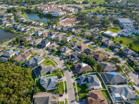Aerial view of residential area in Tampa Florida with green environment and city view by drone