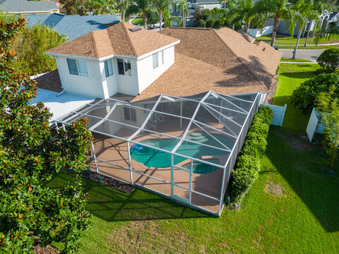 Aerial Drone Photo of House Pool and Roof by Lake near Tampa Florida