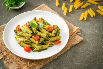 penne pasta with pesto sauce and tomatoes