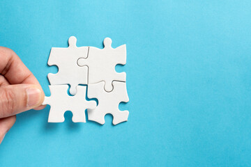 Four pieces of plain white jigsaw puzzle for business concept