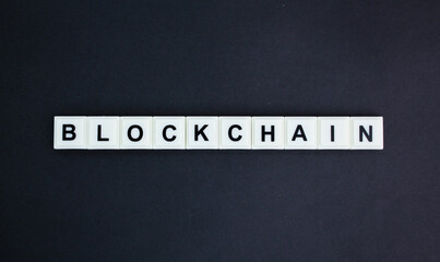 letters of the alphabet with the word blockchain. concept of digital transfer or connection money.