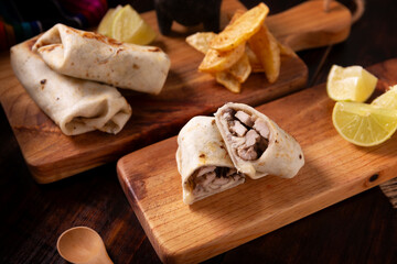 Burritos. Wrapped wheat flour tortilla, can be filled with various ingredients such as scrambled eggs or minced meat, beans and vegetables, a very popular dish in Mexico and the southern USA.