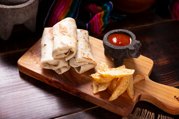 Burritos. Wrapped wheat flour tortilla, can be filled with various ingredients such as scrambled eggs or minced meat, beans and vegetables, a very popular dish in Mexico and the southern USA.