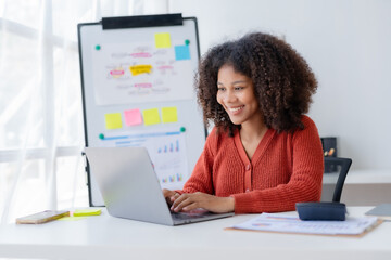 Businesswoman using laptop computer in the office. Female shopping or chatting online in social networks, freelance working on laptop projects.