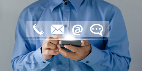 Businessman using Smart Phone with the email, call phone, address, Chat message icons.Customer...