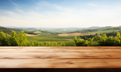 empty wooden table top with a blurred vineyard landscape in the background
