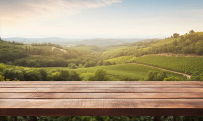 empty wooden table top with a blurred vineyard landscape in the background