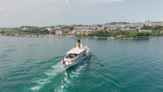 Aerial of beautiful old ferry sailing towards the city of Lausanne in Switzerland