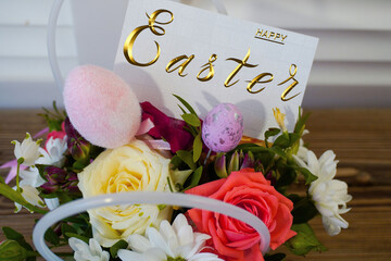Happy easter! Flat Lay, Internet banner, postcard on Easter.  Bouquet of flowers and Easter eggs