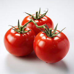 A pair of ruby red tomatoes, their glossy surface reflecting the light, against a clean white backdrop.