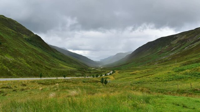 Glencoe Valley time lapse. Green Scottish landscape on a cloudy summer day. Scotland, UK.