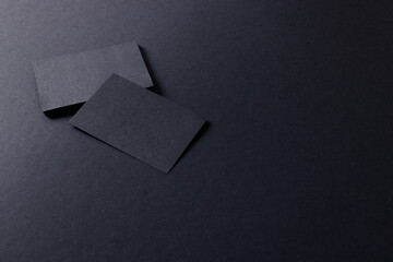 Black business cards with copy space on black background