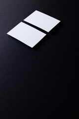 White business cards with copy space on black background
