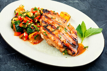 Tuna steak with grilled vegetables.
