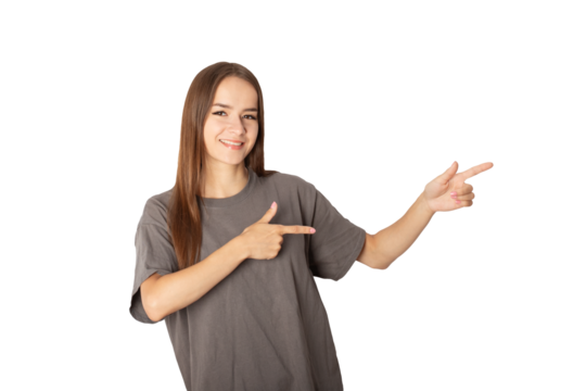teenager smiling, young woman pointing at a place for text,person isolated, cute cheerful female student with long hair