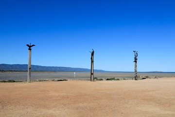 Sculptures at Port Germein jetty against clear blue sky